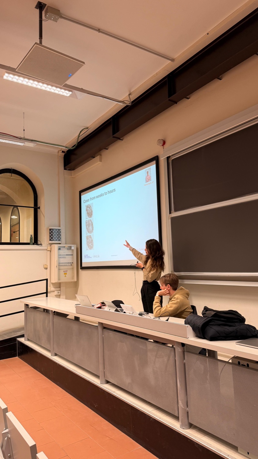 A speaker presenting an application case at Politecnico di Milano
